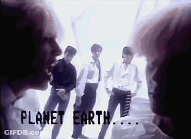 A Group Of People Standing Next To Each Other With The Words Planet Earth Written On The Bottom GIF