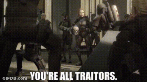 A Group Of People Standing Next To Each Other With The Words `` You 'Re All Traitors '' Written On The Screen . GIF