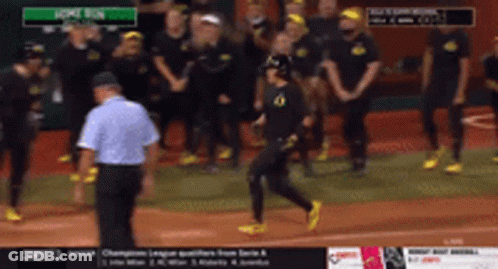 A Group Of People Standing On A Baseball Field With The Words Home Run On The Screen GIF