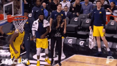 A Group Of People Standing On A Basketball Court With #Pacers On The Bottom Right GIF