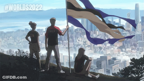 A Group Of People Standing On A Hill Holding A Flag That Says Worlds2022 GIF