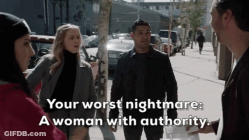 Group Of People On Sidewalk With Woman Authority GIF