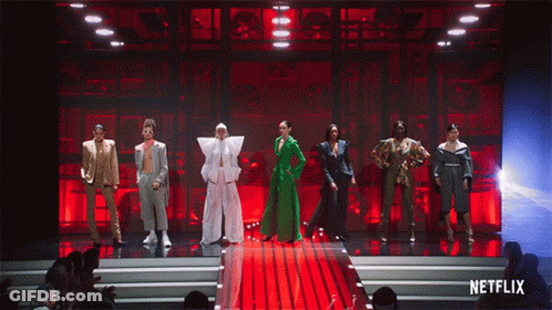 A Group Of People Standing On A Stage With Netflix Written On The Bottom GIF