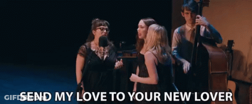 A Group Of People Standing On A Stage With The Words Send My Love To Your New Lover GIF