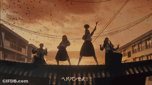 A Group Of People Standing On Top Of A Roof With Birds Flying Around Them GIF
