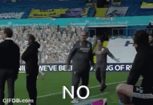 A Group Of People Standing On Top Of A Soccer Field With The Word No Written On The Ground . GIF