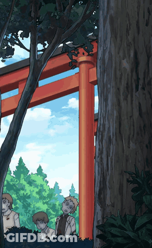 A Group Of People Standing Under A Torii Gate In A Forest GIF