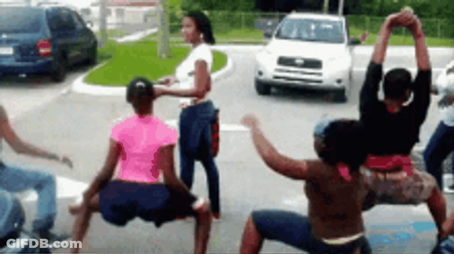 A Group Of People Twerking On Road GIF