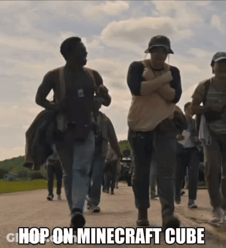 A Group Of People Walking Down A Street With The Words Hop On Minecraft Cube On The Bottom GIF
