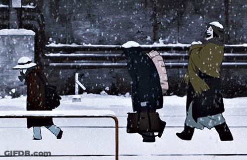 A Group Of People Walking In The Snow With The Letter K Visible In The Background GIF