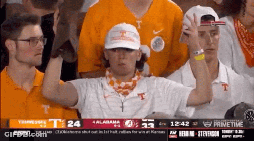 A Group Of People Watching A Football Game Between Tennessee And Alabama On Espn GIF