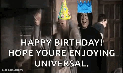 A Group Of People Wearing Birthday Hats Are Standing Next To Each Other . GIF