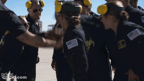 A Group Of People Wearing Ear Muffs And Jackets With The Word Prime On The Bottom Right GIF