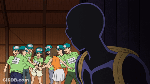 A Group Of People Wearing Green Shirts With Chinese Writing GIF