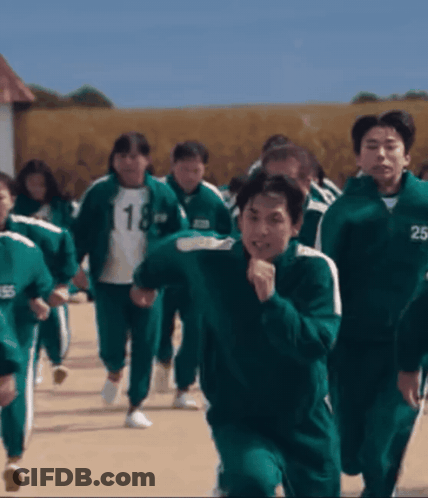 A Group Of People Wearing Green Uniforms With The Number 18 And 25 On Their Jackets GIF