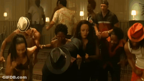 A Group Of People Wearing Hats Are Dancing GIF