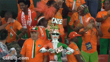 A Group Of People Wearing Orange Shirts With Cnse On Them GIF