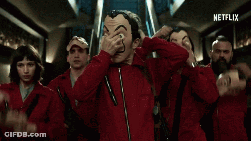 A Group Of People Wearing Red Jumpsuits And Masks With A Netflix Logo In The Corner GIF