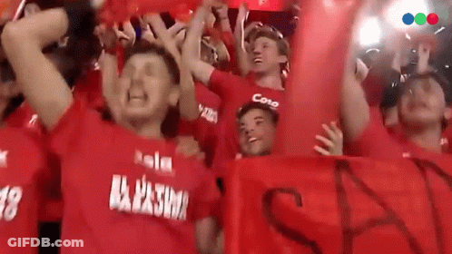 A Group Of People Wearing Red Shirts With The Word Cono On The Front GIF