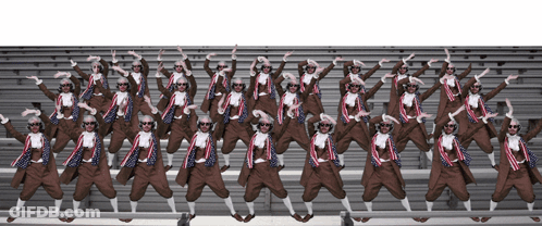 A Group Of People Wearing Sunglasses Are Dancing In A Line GIF