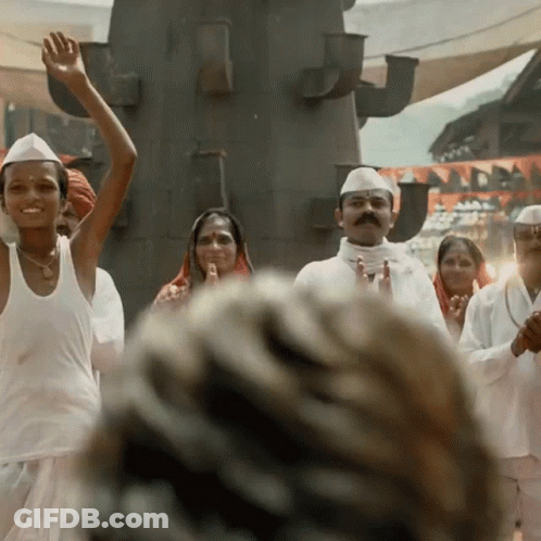 A Group Of People Wearing White Shirts And Hats Are Dancing GIF