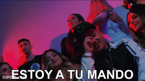 A Group Of People With The Words Estoy A Tu Mando Written On The Bottom GIF