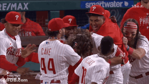 A Group Of Philadelphia Phillies Baseball Players Celebrate A Win GIF