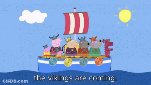 A Group Of Pigs Dressed As Vikings Are Standing On A Boat With The Words " The Vikings Are Coming " Below Them GIF