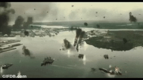 A Group Of Planes Are Flying Over A Body Of Water .. GIF