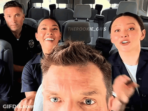 A Group Of Police Officers Are Posing For A Picture In A Van With The Hashtag Therookie GIF