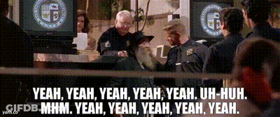 A Group Of Police Officers Are Standing In Front Of A Sign That Says Yeah Yeah Yeah GIF