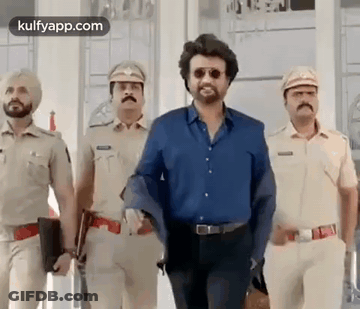 A Group Of Police Officers Are Standing Next To Each Other . GIF