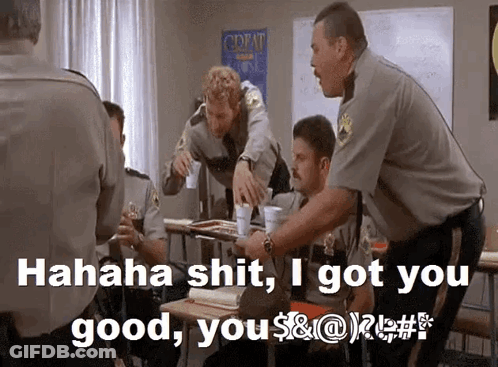 A Group Of Police Officers In A Classroom With The Words " Hahaha Shit I Got You Good " GIF