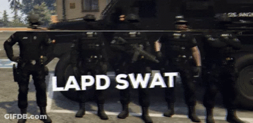 A Group Of Police Officers Standing In Front Of A Vehicle That Says Lapd Swat On It GIF