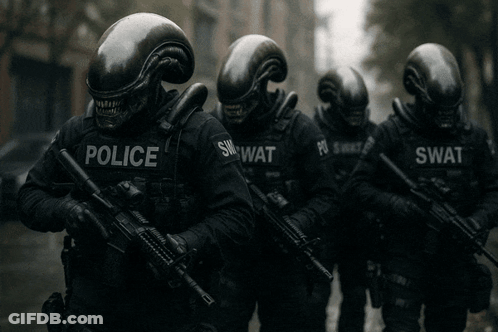 A Group Of Police Officers Wearing Helmets And Holding Guns GIF