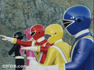 A Group Of Power Rangers Are Standing In A Row With Their Arms Outstretched GIF