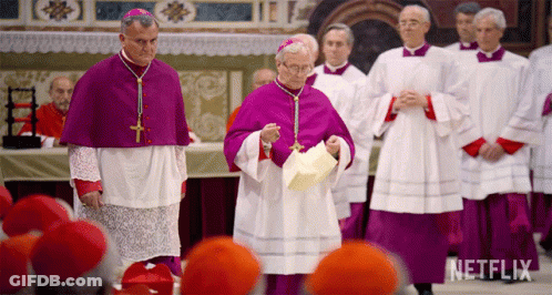 A Group Of Priests Are Standing In A Church With A Netflix Logo Behind Them GIF