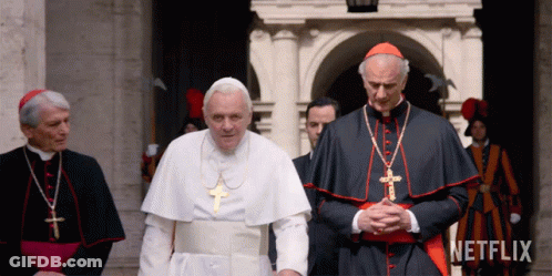 A Group Of Priests Standing In Front Of A Building With Netflix Written On The Bottom GIF