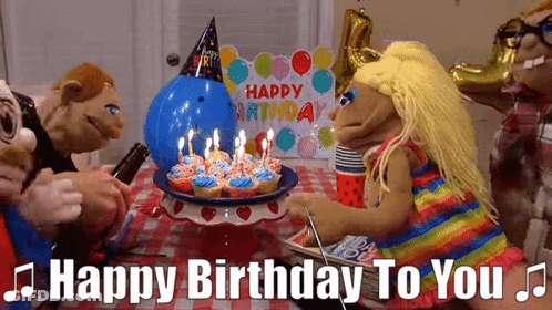 A Group Of Puppets Are Celebrating A Birthday GIF