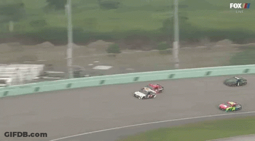 A Group Of Race Cars Are Racing On A Track With Fox Broadcasting GIF