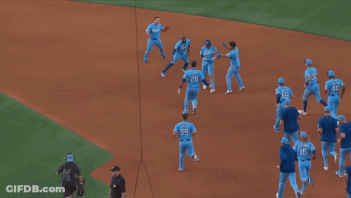 A Group Of Rangers Baseball Players Are Celebrating A Win GIF