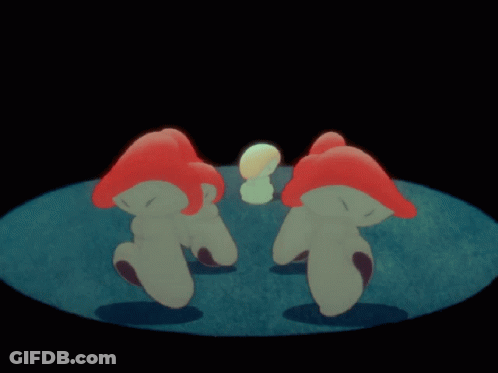 A Group Of Red And White Mushrooms Are Standing In A Circle On A Blue Surface GIF