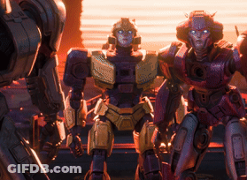A Group Of Robots Are Standing Next To Each Other And One Of Them Has A Red Head GIF