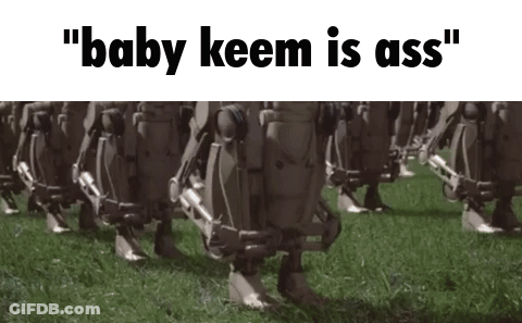 A Group Of Robots Are Walking In A Field With The Words " Baby Keem Is Ass " On The Bottom . GIF