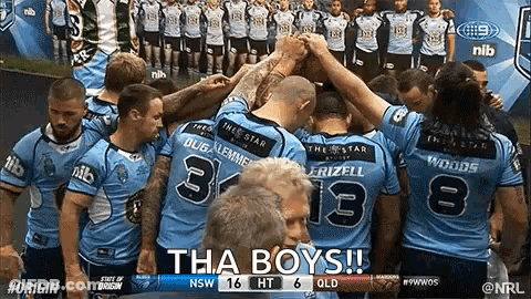A Group Of Rugby Players Are Huddled Together In A Huddle With The Words Tha Boys Written On The Bottom GIF