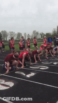 A Group Of Runners Are Getting Ready To Run On A Track GIF