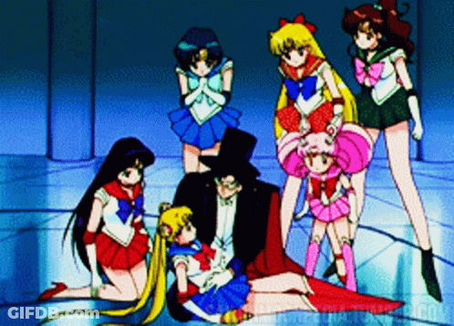 A Group Of Sailor Moon Characters Standing Around A Man In A Top Hat GIF