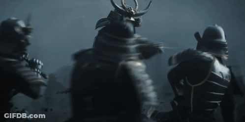 A Group Of Samurai In Armor Are Standing In The Dark GIF
