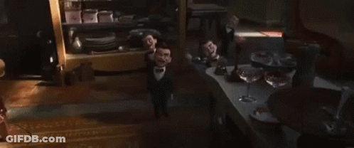 A Group Of Scary Dolls In Tuxedos Are Standing In A Room . GIF