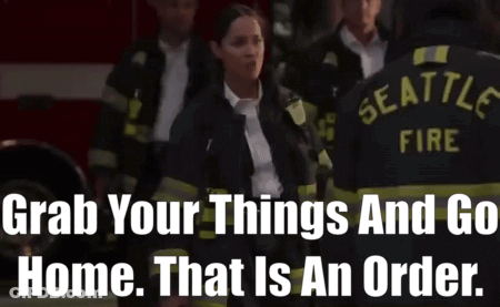 A Group Of Seattle Firefighters Standing In Front Of A Fire Truck GIF